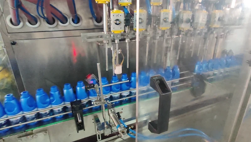 Bottle-filling demonstration with nozzles and conveyor