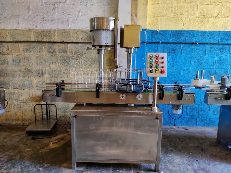 Single Head Screw Capping Machine manufactured in India by H M Pharma Machines